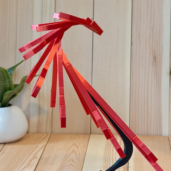A 3D-printed balancing dragon that sits on your desk and subtly sways — kinetic desk art meets fidget toy with a fantasy twist.