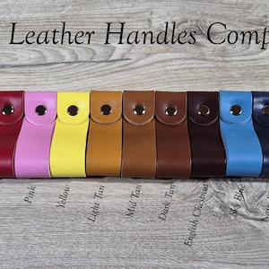 May include: A collection of leather handles in various colors, including black, grey, burgundy, red, pink, yellow, tan, brown, blue, and green. Each handle is secured with a metal snap. The text "The Leather Handles Company" is at the top.