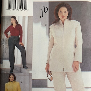 May include: A sewing pattern for a white pantsuit with a mandarin collar and a zipper closure. The pattern is for sizes 26W-28W-30W. The pattern is from the MODE Magazine Collection.