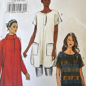 May include: A sewing pattern from Very Easy Vogue, V8924, featuring illustrations of three different tunic-style tops. The pattern includes sizes Lrg-XXL. The tops are in white, red, and a patterned blue and black fabric.