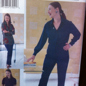 May include: A fashion magazine page featuring a woman in a navy blue button-down shirt and matching pants. The magazine cover includes the text "MODE MAGAZINE COLLECTION" and pattern sizes 14W-16W-18W.