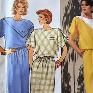 May include: A set of three ceramic mugs with a speckled, matte finish. The mugs are in shades of cream, light gray, and dark gray. Each mug has a simple, minimalist design and a rounded handle.