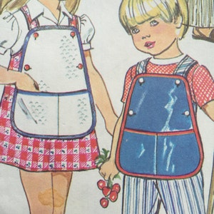 May include: Illustration of two children wearing vintage aprons. The girl's apron is white with a red gingham skirt, while the boy's is blue with striped pants. Both aprons have red trim and large pockets.