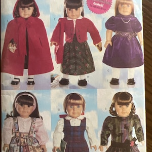 May include: A sewing pattern for making doll clothes. The pattern includes instructions for making a red cape, a plaid skirt, a green plaid dress, a purple dress, and a plaid dress with a green and black plaid pattern. The pattern is for dolls that are 18 inches tall.