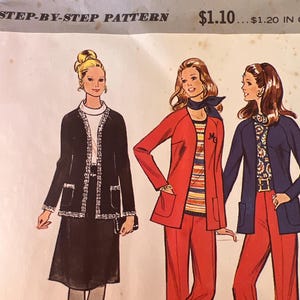 May include: A vintage McCall's sewing pattern, number 3042, featuring illustrations of three women in stylish 1970s outfits. The outfits include a black skirt suit, a red pantsuit, and a navy blue pantsuit. The pattern is for misses' sizes.