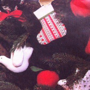 May include: A Christmas tree decorated with red and white stockings, red ornaments, and a white crocheted dove.
