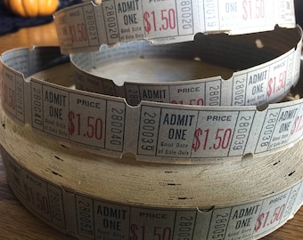 May include: Several rolls of vintage admission tickets. Each ticket is printed with "ADMIT ONE" and the price of $1.50 in red ink. The tickets are a light gray color and appear to be made of paper.