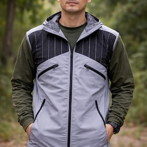 May include: A set of three ceramic mugs with a speckled, matte finish. The mugs are in shades of cream, light gray, and dark gray. Each mug has a simple, minimalist design and a rounded handle.