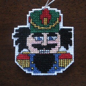 Handmade Nutcracker Face Christmas Ornament: Counted Cross Stitch. Proceeds donated to Carter&#39;s Kids