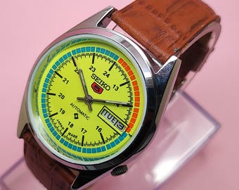 Orologio da uomo Seiko 5 automatico ricondizionato con quadrante giallo, giorno e data, meccanico vintage da 36 mm.