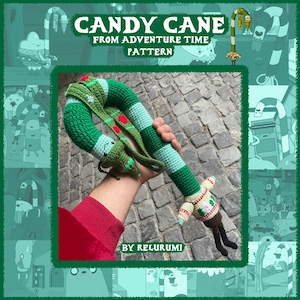 May include: A handmade crochet candy cane from Adventure Time. The candy cane is green and light blue with red accents. The text "CANDY CANE FROM ADVENTURE TIME PATTERN" is at the top. The candy cane is held by a person wearing a red shirt. The text "BY RELURUMI" is at the bottom.