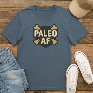 Paleo AF T-Shirt – Funny Paleo Diet Shirt for Men & Women | Primal Lifestyle Graphic Tee | Caveman Keto Fitness Shirt | Paleo Gift Idea