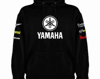 Unisex-Sweatshirt mit oder ohne Kapuze und Kängurutasche, bedruckt mit Motorsport-Logos. Optional personalisierter Name auf der Rückseite. Modell Sdyh