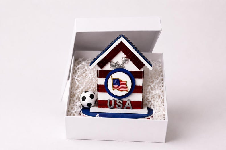 USA soccer mini house placed inside white gift box with protective filler for safe packaging