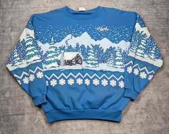 Sudadera Alaska para mujer, talla grande, azul, estilo vintage de los 90, con estampado de cabaña de invierno y detalles acolchados.