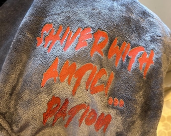 Shiver with antici pation throw blanket