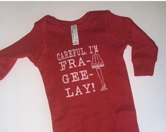 Careful I’m fra gee lay long sleeve onesie Christmas story leg lamp.