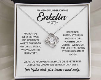 May include: A silver-toned necklace with a sparkling, round pendant in a gift box. The box contains a card with German text, including the word "Enkelin" and the phrase "Ich Liebe dich für immer und ewig."