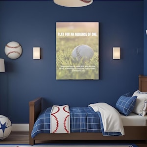 May include: A baseball-themed bedroom with a blue wall, a bed with a baseball-stitched pillow, and a baseball-shaped lamp. A framed print reads "PLAY FOR AN AUDIENCE OF ONE." A baseball is on the wall. The room has a sports theme.