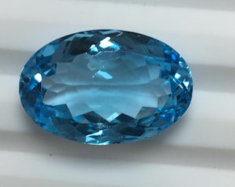 Genuine natural swiss blue topaz faceted gemstone good colour oval 12.40 carat 18x11.6x7 mm