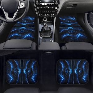 May include: Set of car floor mats with a black and blue lightning bolt design. The mats are visible in the front and back of the car, with a matching design. The mats are designed to protect the car's interior.