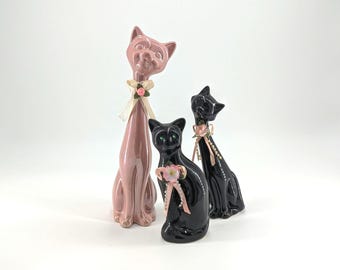 Vintage Ceramic Cat Figurines Set of 3 Pink & Black MCM Style Cats Floral Ribbon Decor Retro Kitsch Shelf Decor