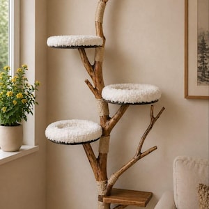 May include: A wall-mounted cat tree constructed from a natural wooden branch with multiple levels. It features three circular platforms topped with white, plush, textured cushions and one lower rectangular wooden shelf, accented with tan rope.