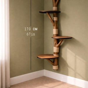 May include: A wooden cat tree with three platforms, attached to a wall. The tree is made of natural-looking branches and has a height of 67 inches (170 cm). The platforms are round and made of wood, and the branches are wrapped with rope.