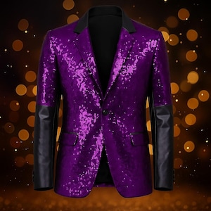 May include: A purple sequined blazer with black leather sleeves and a black collar. The single-breasted jacket has a one-button closure and two front pockets. The background has a bokeh effect with golden-colored circles.