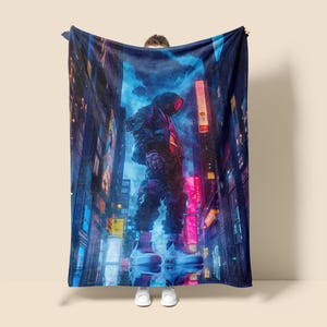 May include: A digitally printed blanket featuring a futuristic cityscape with a figure in a hooded outfit. The design incorporates neon lights, vibrant colors, and a cyberpunk aesthetic, creating a visually striking piece.