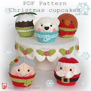 May include: A set of five felt Christmas cupcake patterns, including a snowman, Santa Claus, a robin, a polar bear, and a Christmas pudding. The patterns are arranged on a white cake stand with holly and red buttons. The text "PDF Pattern Christmas cupcakes set one" is at the top of the image.