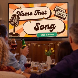 May include: A television screen displays the words "Name That Song" with a retro microphone and cassette tapes graphic. The text "1976 Edition" is also visible. People are gathered around, some holding drinks.
