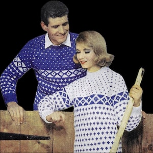 May include: A vintage image of a couple wearing matching blue and white patterned jumpers. The jumpers feature a geometric design. The man is wearing a collared shirt under his jumper. The woman is holding a wooden object.