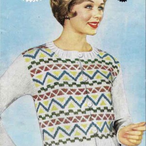 May include: Vintage knitwear design B1565. A woman is wearing a white cardigan with a geometric pattern in yellow, blue, and maroon. The cardigan has long sleeves and button closures. The image has text that says "Double Knitting" and "Home Tested Designs."