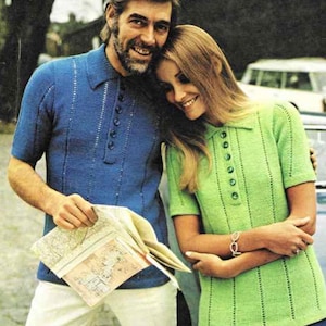 May include: A couple wearing matching knitted polo shirts. The man wears a blue shirt with white pants, holding a map. The woman wears a green shirt. Both shirts have vertical stripe detailing and button-up collars. The image has a vintage aesthetic.