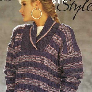 May include: A long-sleeved knit jumper featuring a shawl collar and a textured pattern of horizontal stripes in shades of dark purple and light pink. The garment has a ribbed collar edge and a thick, cable-knit construction throughout the body.