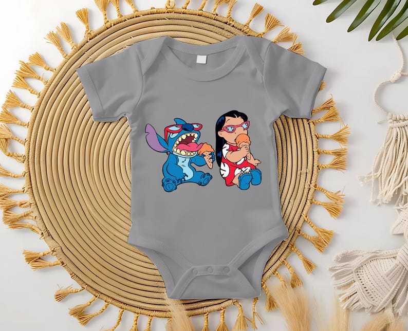 May include: Gray baby onesie featuring a colorful graphic of Stitch and Lilo from the Disney movie Lilo & Stitch. Stitch is blue, wearing sunglasses, and eating ice cream. Lilo is wearing a red dress and eating ice cream.
