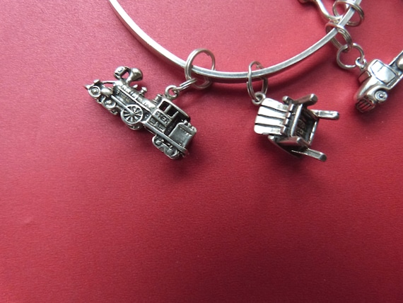 Sterling Silver Hook Bracelet with Six Charms, Train, Baby Carriage, Truck, etc.