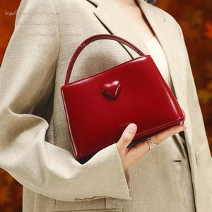 Red Cowhide Leather Crossbody Bag: Adjustable Strap, Heart Detail