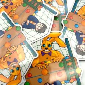 May include: A collection of stickers featuring a yellow rabbit character with blue eyes and a purple bow tie. The stickers also depict a person in a blue shirt and a brown structure with colorful balls.
