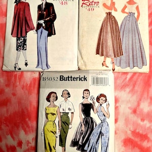 May include: Three vintage Butterick sewing pattern envelopes. The patterns feature illustrations of women's clothing designs from the mid-20th century. The envelopes are labeled with the Butterick brand and "Retro" designs.