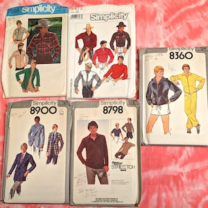 May include: A collection of vintage Simplicity sewing patterns featuring illustrations of men's clothing. The patterns showcase various styles, including shirts, jackets, and suits. The patterns are displayed on a red and white tie-dye background.