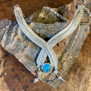 Crossing feathers turquoise necklace