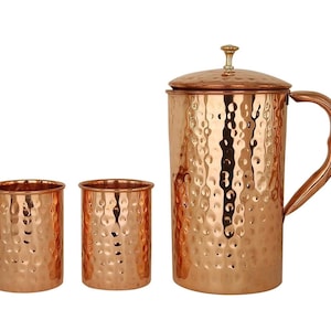 May include: A set of three ceramic nesting bowls in shades of blue, green, and white. The bowls feature a speckled glaze and a simple, modern design. The largest bowl measures approximately 8 inches in diameter.