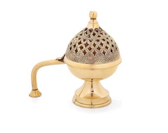 May include: A polished brass incense burner featuring a rounded base, a pedestal stand, and a curved handle. The top is a removable dome lid with an intricate, openwork lattice pattern and a small spherical finial at the very top center.
