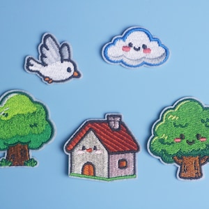 May include: A set of five embroidered patches featuring a white bird, a smiling cloud with pink cheeks, two green trees with brown trunks, and a house with a red roof, a grey facade, and a small chimney, all arranged on a light blue background.