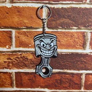 Piston Head Dude Keychain