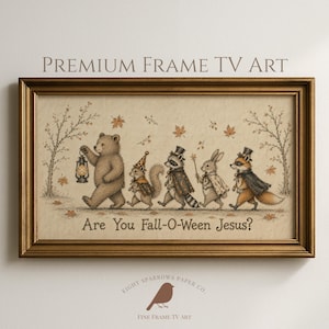 May include: A rectangular gold-toned frame containing a horizontal illustration of a bear, squirrel, raccoon, rabbit, and fox walking in a line. The animals wear capes and hats, and the text "Are You Fall-O-Ween Jesus?" is printed below them.