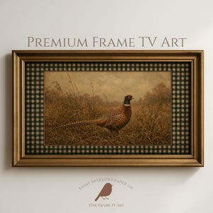 May include: A rectangular digital television art display featuring a pheasant in a field, framed in a metallic gold border with a black and white checkered mat. The text PREMIUM FRAME TV ART is displayed above the frame in a serif font.