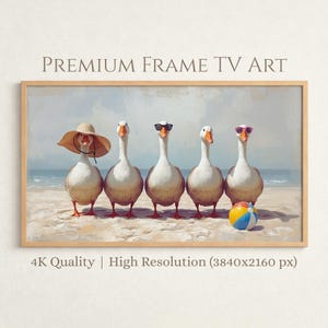 May include: A framed print featuring five geese on a beach. The geese are wearing sunglasses and a sun hat. A colorful beach ball sits on the sand. The text "PREMIUM FRAME TV ART" is at the top. The text "4K Quality | High Resolution (3840x2160 px)" is at the bottom.